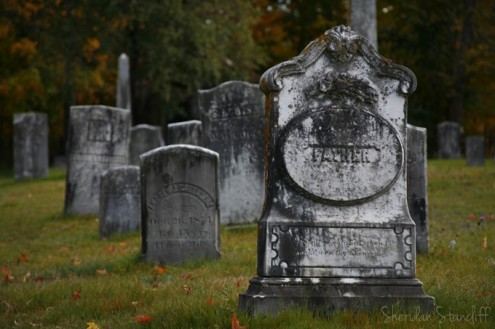 A shot of headstones in a cemetery in New England