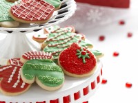 red and green Christmas cookies on a cake stand