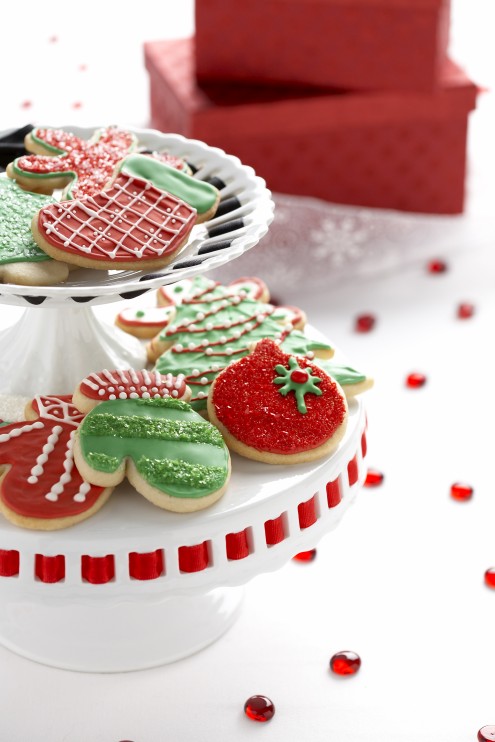red and green Christmas cookies on a cake stand