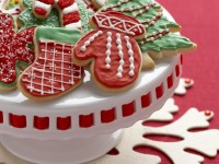 red and green Christmas cookies on a cake stand