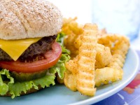Cheeseburger on plate with French fries